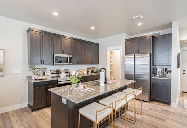 Building Photo - AWESOME END UNIT with attached 2 stall garage and additional personal parking spot on the exterior