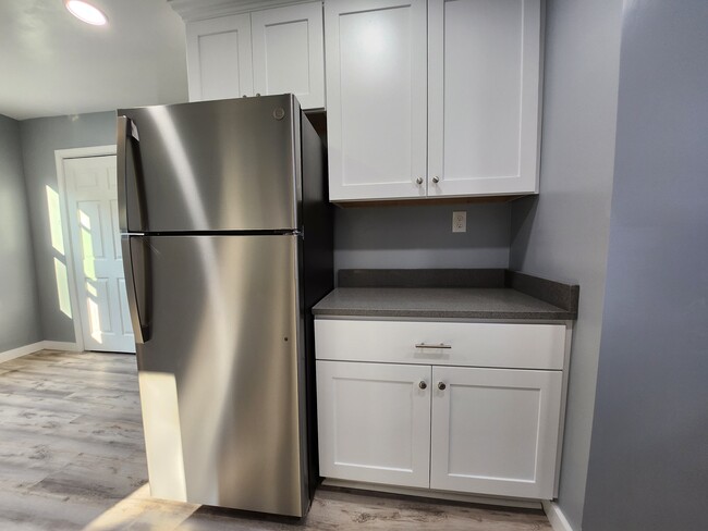 Kitchen features a full size fridge. - 301 Broad St