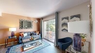 Located at 1594 W Secret Garden Pl in Salt Lake City, Utah, this single-floor residence offers three bedrooms and two full bathrooms within a smartly utilized layout. The living room serves as the heart of the home, featuring warm accent walls, wood-style flooring, and a sliding glass door that opens to a private balcony with tree-lined views, filling the space with natural light. A dedicated dining nook adjacent to the living area provides an intimate setting for meals. The galley-style kitchen is equipped with stainless steel appliances, dark countertops, crisp white cabinetry, and wood-style flooring, offering an efficient and functional workspace. The primary bedroom is a comfortable retreat, carpeted for warmth, with ample wall space and soft neutral tones. Additional bedrooms feature natural light through large windows with views of surrounding greenery. Both bathrooms are finished with dark countertops, wood-style flooring, and tub-shower combinations. A dedicated laundry room with full-size washer and dryer adds everyday convenience. Throughout the home, consistent flooring, neutral walls, and thoughtful design details create a cohesive and inviting atmosphere.