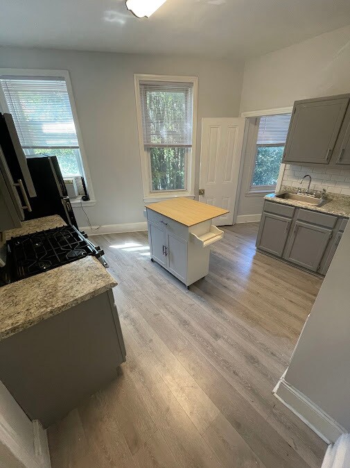 Kitchen w/ Island - 2432 E Norris St Apartments