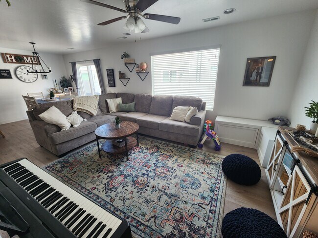 Open, well-lit living room - 1712 W 10 S