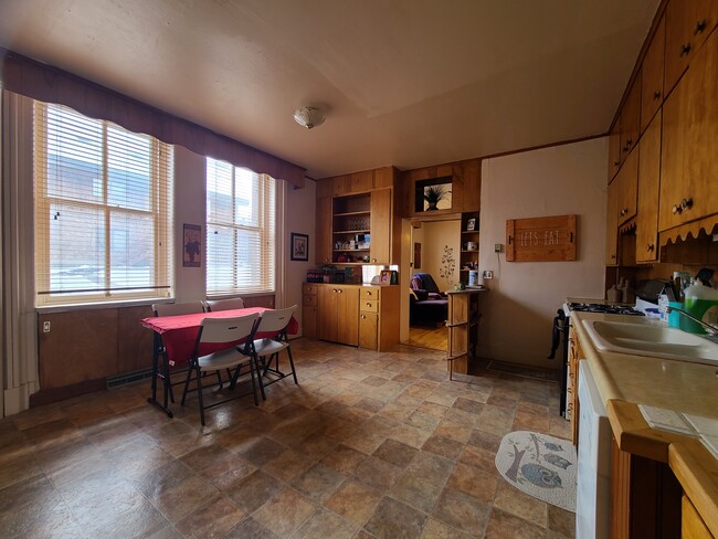 Kitchen looking towards living room. - 206 E Broadway St