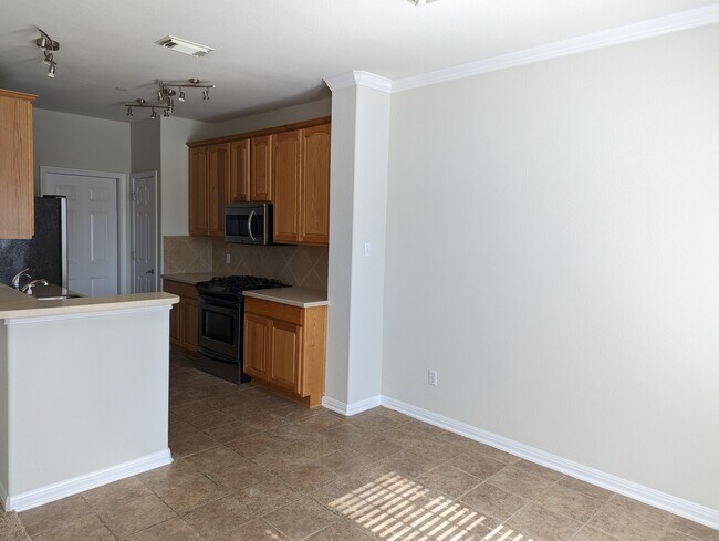 View of kitchen from dining area - 1101 E Parmer Ln