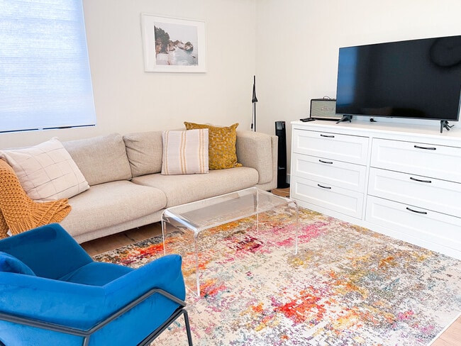 Living room with smart TV and Bluetooth speaker - 4255 San Rafael Ave