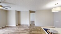 Located at 4545 Willa Creek Dr in Winter Springs, Florida, this single-floor, 2-bedroom, 3-bathroom home offers a well-designed layout that maximizes functionality throughout. Wood-look flooring flows consistently across the living areas and bedrooms, complemented by neutral warm-beige walls and textured ceilings that create a cohesive, inviting atmosphere.

The open-concept kitchen is a standout feature, equipped with stainless steel appliances including a refrigerator, range, and microwave. White cabinetry and a white quartz peninsula with a built-in sink provide ample prep and storage space, seamlessly connecting to the dining area, which is accented by a stylish drum pendant light.

The spacious living room offers an open, airy feel with clean sightlines into the adjacent hallway. The primary bedroom is generously sized, with a natural window providing comfortable natural light. The second bedroom is equally well-proportioned. Both are served by well-appointed bathrooms featuring white vanities with quartz countertops, wood-look tile flooring, and brushed nickel fixtures. A dedicated laundry room adds everyday convenience. Two closets and dual hallways round out this efficiently organized home.