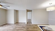 Located at 4545 Willa Creek Dr in Winter Springs, Florida, this single-floor, 2-bedroom, 3-bathroom home offers a well-designed layout that maximizes functionality throughout. Wood-look flooring flows consistently across the living areas and bedrooms, complemented by neutral warm-beige walls and textured ceilings that create a cohesive, inviting atmosphere.

The open-concept kitchen is a standout feature, equipped with stainless steel appliances including a refrigerator, range, and microwave. White cabinetry and a white quartz peninsula with a built-in sink provide ample prep and storage space, seamlessly connecting to the dining area, which is accented by a stylish drum pendant light.

The spacious living room offers an open, airy feel with clean sightlines into the adjacent hallway. The primary bedroom is generously sized, with a natural window providing comfortable natural light. The second bedroom is equally well-proportioned. Both are served by well-appointed bathrooms featuring white vanities with quartz countertops, wood-look tile flooring, and brushed nickel fixtures. A dedicated laundry room adds everyday convenience. Two closets and dual hallways round out this efficiently organized home.