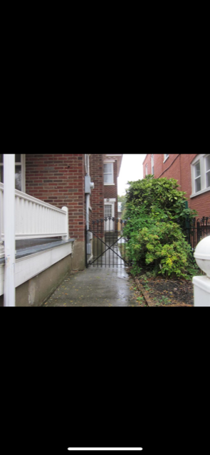 Gate to side of house - 551 W Walnut St