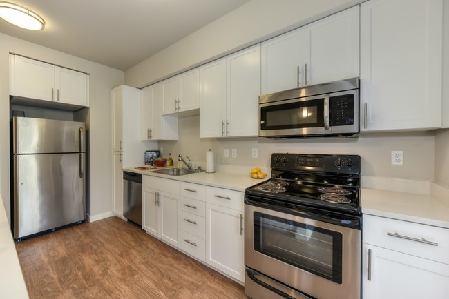 Kitchen with Wood Inspired Floors - Madison Bellevue Apartments