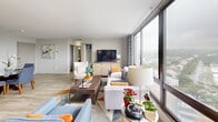 Located at 511 Four Mile Rd in Alexandria, VA, this thoughtfully designed single-floor residence offers a seamless blend of comfort and contemporary style. The expansive living room is a standout, anchored by floor-to-ceiling windows that flood the space with natural light and frame sweeping panoramic views of the surrounding Alexandria landscape. Light wood-tone flooring runs throughout, creating a cohesive and airy feel. The dining area sits adjacent to the entry, providing a welcoming space defined by clean white walls and stylish décor accents. The kitchen is well-appointed with gray cabinetry, granite-style countertops, stainless steel appliances including a gas range and over-the-range microwave, and the added convenience of an in-unit washer. The two bedrooms each offer their own distinct character — one features a bold blue accent wall with a large window overlooking scenic treetop views, while the second is highlighted by a warm orange accent wall and ample closet space with louvered doors. Both rooms include dedicated closets and light flooring. The bathroom is finished with tiled walls, a tub-shower combination, and a wood-toned vanity. This well-appointed residence offers a functional layout ideal for comfortable everyday living.