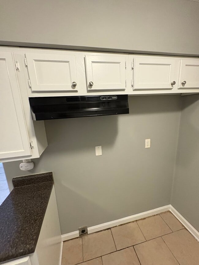 Photo - This 2BR/1BA includes a nice-sized living area, an ample kitchen, a fenced-in Townhome