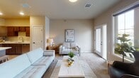 This single-floor residence on 26th St S in Fargo, North Dakota, offers a thoughtfully designed open-concept layout that seamlessly connects the kitchen, dining, and living areas. The kitchen is a functional centerpiece, featuring rich dark-stained cabinetry, light speckled stone countertops, stainless steel appliances, and a generous island with pendant lighting overhead. Luxury vinyl plank flooring runs throughout the kitchen and dining area, transitioning to plush carpet in the living spaces.

The living room is generously proportioned, bathed in natural light from large windows and a set of glass exterior doors that open to the outdoors. A dedicated nook off the living area provides a quiet space suitable for a home office or study area. The bedroom is comfortably sized with a large window offering exterior views and direct access to the full bathroom. The bathroom includes a dual-sink vanity with dark cabinetry, a soaking tub, and hardwood-style flooring. A spacious walk-in closet with wire shelving and carpeted flooring provides ample storage. The overall ambiance is calm, modern, and move-in ready.
