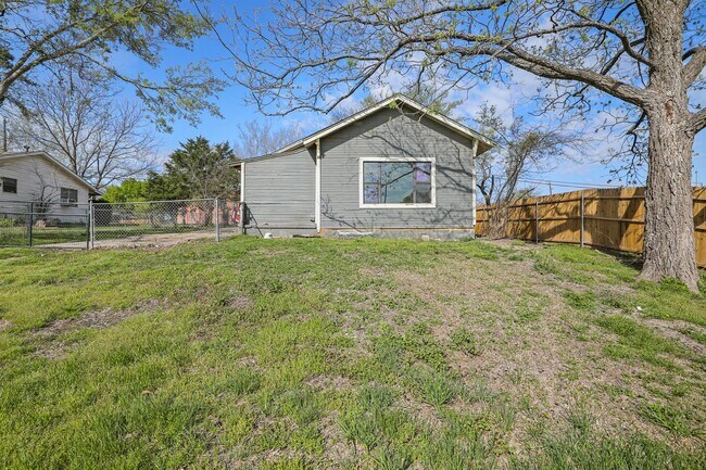 Building Photo - White picket fence cottage, ready to be your next home!