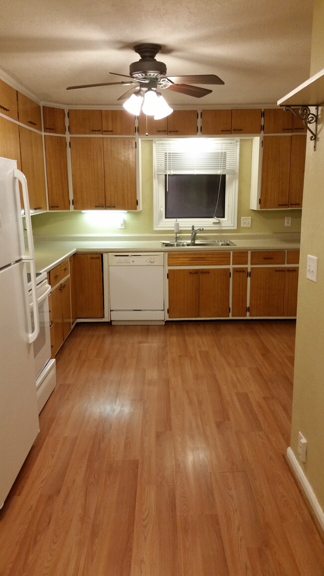 Kitchen comes with all appliances, and has cabinets that extend to the ceiling. - 334 N Belmont Dr