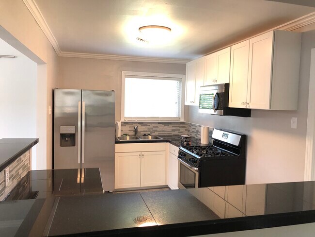 New light fixtures, stainless steel refrigerator with ice maker and water dispenser, new stainless steel microwave &amp; easy cleaning oven! - 914 Campbell St
