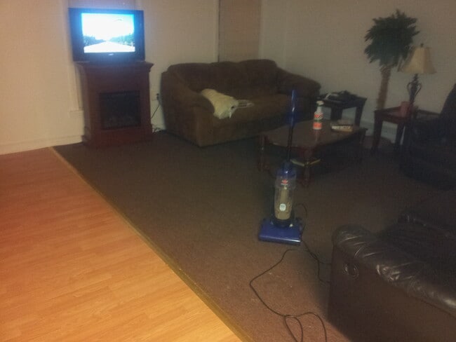 older photo of living room - 167 S Bridge St