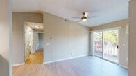 Located at 5110 Biscayne Ave in Racine, WI, this two-bedroom, two-bathroom home offers a well-organized single-floor layout designed for comfortable everyday living. The open combined living and dining area serves as the heart of the home, featuring light wood-style flooring, a ceiling fan, and a sliding glass door that fills the space with natural light and leads directly to a private balcony overlooking lush greenery. The kitchen is thoughtfully updated with white shaker-style cabinetry, marble-look countertops, a stainless steel dishwasher, and an electric range, all complemented by a pendant light and ample storage. The primary bedroom offers generous proportions with soft carpeting and its own access to a bathroom featuring a white vanity with a clean countertop and well-lit mirror. The second bedroom also features plush carpet flooring and a large window that brings in abundant natural light with views of the surrounding trees. A hallway connects the rooms efficiently, and four closets throughout provide excellent storage. Additional highlights include an in-unit laundry area and a wall-mounted AC unit. The neutral warm-toned palette throughout creates a calm and welcoming atmosphere.