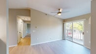 Located at 5110 Biscayne Ave in Racine, WI, this two-bedroom, two-bathroom home offers a well-organized single-floor layout designed for comfortable everyday living. The open combined living and dining area serves as the heart of the home, featuring light wood-style flooring, a ceiling fan, and a sliding glass door that fills the space with natural light and leads directly to a private balcony overlooking lush greenery. The kitchen is thoughtfully updated with white shaker-style cabinetry, marble-look countertops, a stainless steel dishwasher, and an electric range, all complemented by a pendant light and ample storage. The primary bedroom offers generous proportions with soft carpeting and its own access to a bathroom featuring a white vanity with a clean countertop and well-lit mirror. The second bedroom also features plush carpet flooring and a large window that brings in abundant natural light with views of the surrounding trees. A hallway connects the rooms efficiently, and four closets throughout provide excellent storage. Additional highlights include an in-unit laundry area and a wall-mounted AC unit. The neutral warm-toned palette throughout creates a calm and welcoming atmosphere.