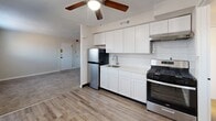 This 460 square foot apartment in Philadelphia offers a well-designed living space on a single floor. The property features one bedroom measuring 150 square feet, providing ample space for a comfortable sleeping area. The layout includes a modern kitchen, one full bathroom, and additional living space.

The interior showcases a contemporary design with a neutral color palette. The bedroom boasts plush carpeting and two windows, allowing natural light to brighten the space. The bathroom features clean white tiling and updated fixtures, creating a fresh and hygienic environment.

The kitchen is a highlight of the apartment, with sleek white cabinetry, stainless steel appliances, and a subway tile backsplash. The space is well-equipped with a refrigerator, stove, and ample counter space for meal preparation. A ceiling fan in the kitchen area aids in air circulation.

The living area is versatile, with carpeted flooring that extends from the bedroom, creating a cohesive look throughout the apartment. Large windows in the living space provide natural light and views of the surroundings.

Overall, this apartment offers a compact yet functional living environment, ideal for individuals or couples seeking a modern, low-maintenance home in Philadelphia.