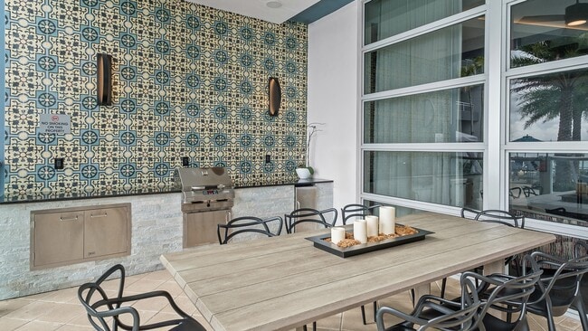 Dine al fresco in refined comfort, just steps from the water - LaVida Apartments