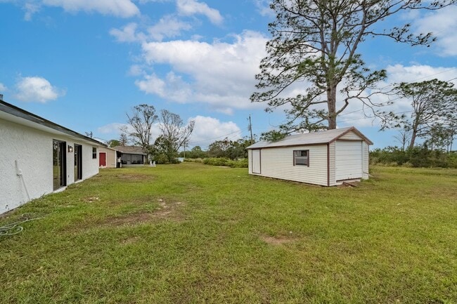 Building Photo - Charming Palm Bay Retreat - Perfect for Relaxation and Entertainment!
