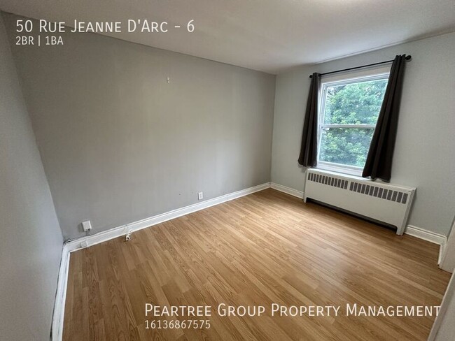 Photo du bâtiment - Joyful Jeanne-D'Arc-2 bed apartment for rent