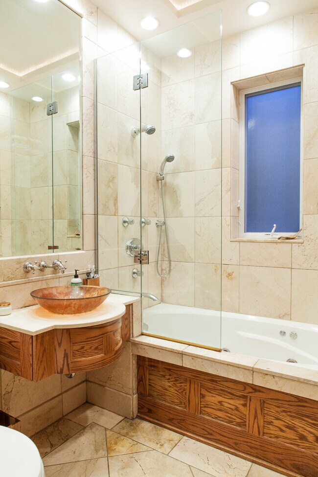 Bathroom- 2 shower heads and jet bath. - 3304 W Palmer St