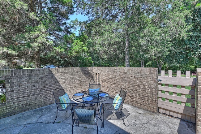 Patio, off of great room with lots of space for a table and area for gardening or flowers - 8001 Charter Oak Ln