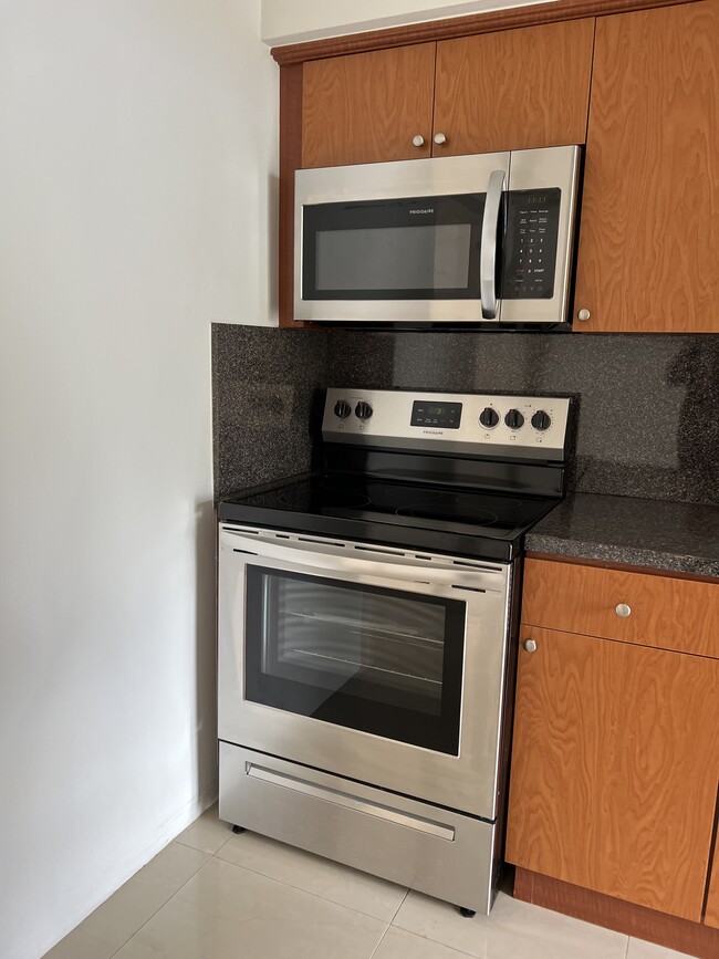 Stainless steel stove, oven and microwave - 5010 SW 26th Ave