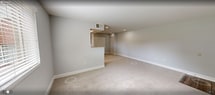 This 600 square foot apartment in Alexandria, VA offers a thoughtful layout maximizing functionality in a compact space. The kitchen showcases modern amenities with stainless steel appliances, rich wood cabinetry, and granite countertops. A window above the sink allows natural light to brighten the galley-style layout.

The open-concept living area seamlessly connects to the kitchen, creating a spacious feel. Plush carpeting in neutral tones covers the living room and bedroom, while the kitchen features durable wood-look flooring. The bedroom, measuring 160 square feet, includes a closet and large window for ample natural light.

The bathroom has been updated with contemporary large-format tiles and a modern shower setup. Throughout the apartment, recessed lighting and ceiling fixtures provide well-distributed illumination. The neutral color palette of light gray walls and white trim creates a clean, versatile backdrop for various decor styles.

Located at 6437 Edsall Rd, this single-floor unit offers urban convenience in a well-maintained space. The efficient design makes excellent use of the 600 square feet, providing comfortable living in a prime Alexandria location.