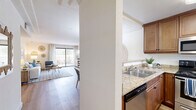 This well-appointed 2-bedroom, 2-bathroom home in Vista, California offers a thoughtfully designed single-floor layout that maximizes both comfort and functionality. The living room serves as the heart of the home, featuring a tile-surround fireplace, crown molding, and large sliding glass doors that open to a private patio, filling the space with natural light and providing outdoor access. Wood-look flooring flows seamlessly throughout the entire home, creating a cohesive and modern aesthetic.

The kitchen is equipped with warm-toned cabinetry, granite countertops, stainless steel appliances, and a pass-through counter that connects to the adjacent dining area. The dining space is accented by a chandelier and crown molding, offering a bright and inviting setting for meals.

The primary bedroom is generously sized, featuring a large sliding-door closet, natural light from a wide window with vertical blinds, and neutral walls that create a calm retreat. The second bedroom is equally comfortable with ample closet space. Both bathrooms are finished with white subway tile tub-and-shower combinations, granite-topped wood vanities, and wood-look flooring, offering a clean and polished look throughout.
