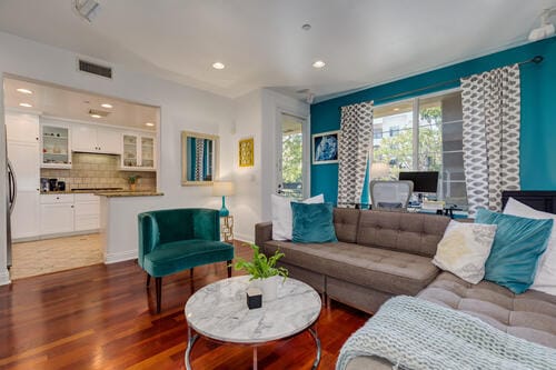 Living Room with Big Windows and Fireplace and Downstairs Patio Access - 5831 Seawalk Dr