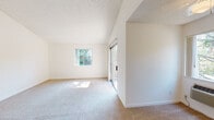 Located at 3352 Cortese Cir in San Jose, CA, this single-floor residence offers a bright and open layout with a clean, neutral aesthetic throughout. The living area is a standout space, featuring soaring vaulted ceilings with a textured finish that amplify the sense of openness. Plush wall-to-wall carpeting runs underfoot, and multiple windows along with a sliding glass door flood the room with natural light while providing direct access to an outdoor balcony with views of surrounding greenery. A ceiling-mounted air conditioning unit ensures comfort year-round. The bedroom is generously proportioned with its own vaulted ceiling, a ceiling fan, and a large window that brings in ample daylight. A built-in shelving unit provides convenient storage. The galley-style kitchen is well-appointed with warm wood cabinetry, stone-finish countertops, tile flooring, and white appliances including a refrigerator, range, and dishwasher. The bathroom features tile flooring, a full tub-shower combination with built-in shelving, and brushed nickel fixtures. Throughout the residence, crisp white walls and an abundance of natural light create a welcoming, airy ambiance well-suited to comfortable everyday living.