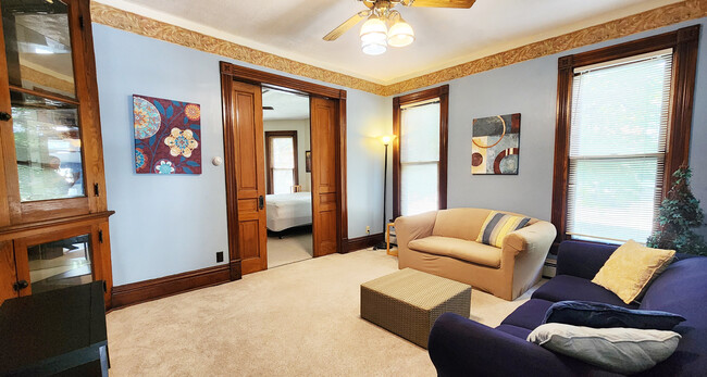 Living room w/ pocket doors to bedroom - 2706-1B Buffalo Rd