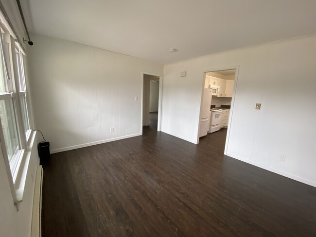 Living room looking toward kitchen - 421 Faucette Mill Rd.