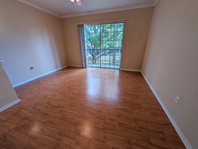 Living room with balcony access - 5218 Hampton Beach Pl