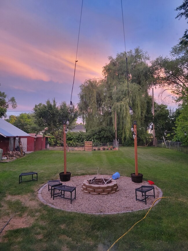 Fire-pit with outdoor lights. Bonus room also has a storage room and greenhouse attached. - 542 W 400 N