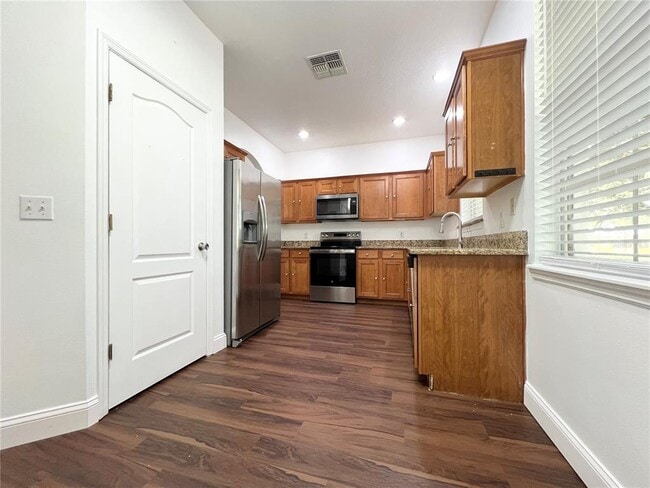 Building Photo - 7138 Five Oaks Dr