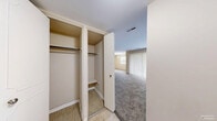 Located at 127 Versailles Cir in Towson, MD, this single-floor, 2-bedroom, 1-bathroom residence offers a well-organized layout designed for comfortable everyday living. The living room is bright and spacious, featuring plush carpeting and a large sliding door dressed with vertical blinds that fills the space with natural light. A separate den provides additional flexible living space, while the dedicated dining room offers a defined area for meals. The kitchen is efficiently designed with warm oak cabinetry, light countertops, tile flooring, and a full suite of black appliances including a gas range, microwave, dishwasher, and refrigerator. Both bedrooms are carpeted and finished in neutral tones; the primary bedroom is generously sized and features multiple closets, while the secondary bedroom includes a window with natural light and accent panel wall detailing. The full bathroom features a tiled tub-shower combination, tile flooring, and an oak vanity. Storage is a standout feature, with six closets throughout — including a spacious walk-in with dual hanging rods. An in-unit laundry area adds everyday convenience to this thoughtfully arranged Towson home.