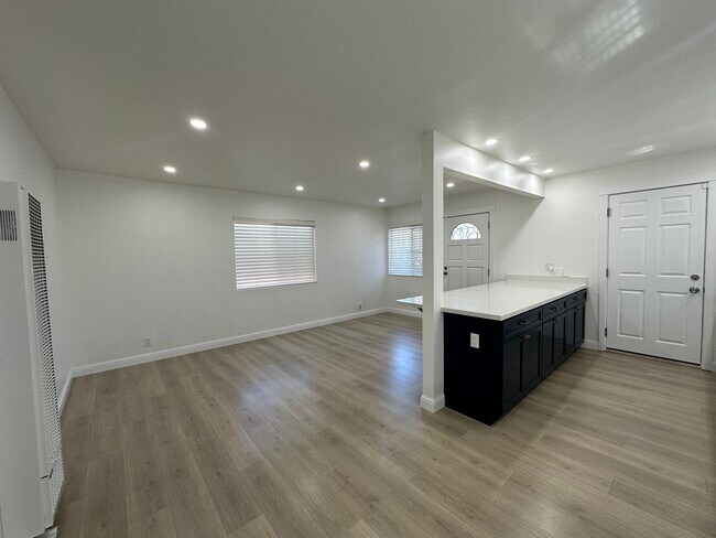 Bright & open layout with wide-plank floors and recessed LED lighting. - 721 15th St
