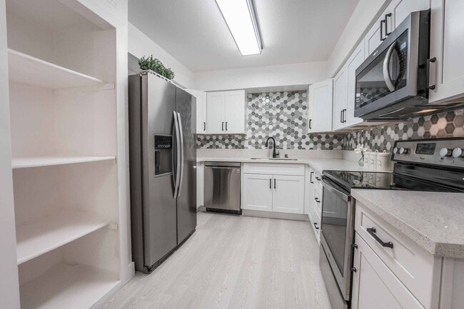 Building Photo - Remodeled Desert Shores Condo with Lakesid...