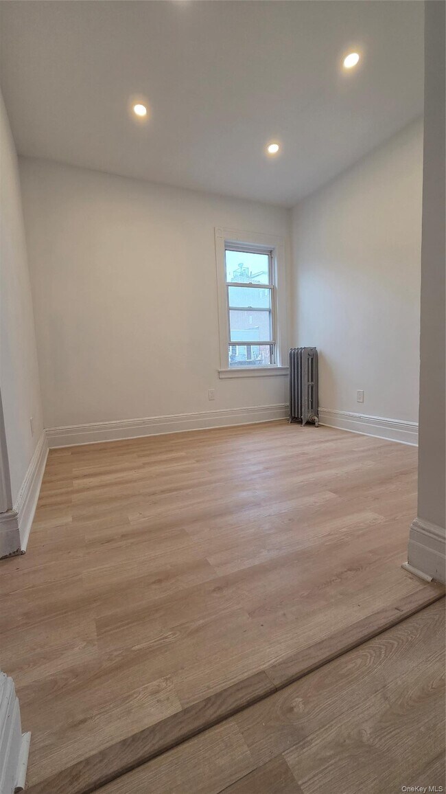 Building Photo - 42-21 65th Pl