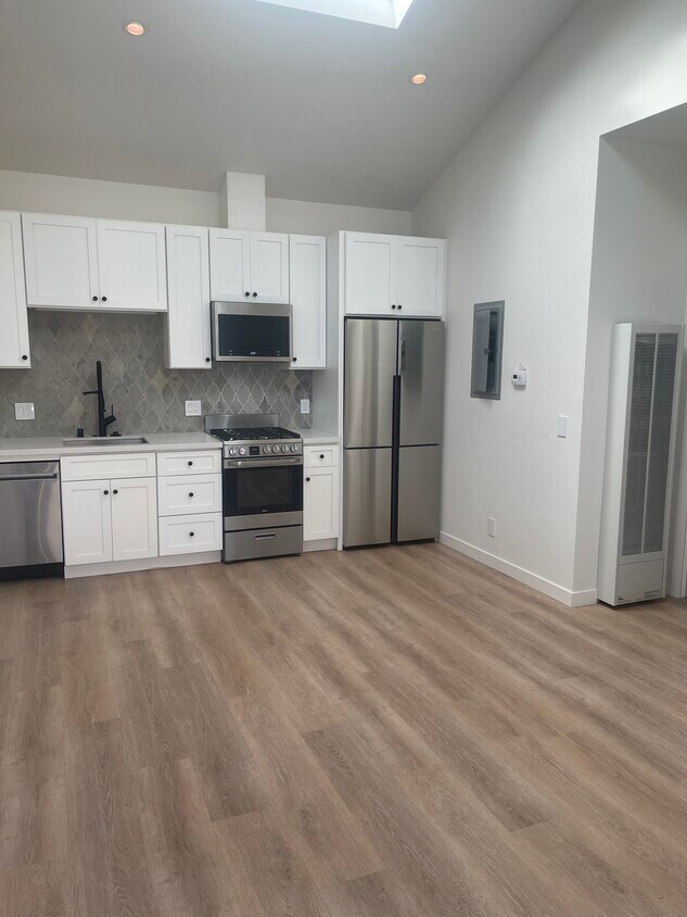 Kitchen and living area. - 747 Vasques Dr