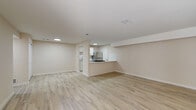 Located at 4205 Barcelos Dr in Saint Louis, MO, this single-floor unit features a clean, neutral aesthetic carried consistently throughout its layout. Light wood-look flooring runs across the main living areas and bedrooms, contributing to a bright, cohesive feel. The open living area is generously sized and connects visually to the kitchen via a pass-through counter, making the space feel connected and functional. A door provides direct access to the exterior from this area.

The kitchen is well-appointed with white shaker-style cabinetry, light quartz countertops, a white subway tile backsplash, and stainless steel appliances including a refrigerator and gas range. The galley-style layout maximizes efficiency while maintaining a modern, clean appearance.

Multiple rooms feature sliding or double-pane windows that allow natural light to fill the space and provide views of the surrounding neighborhood. The bedrooms are well-proportioned with neutral walls and the same light flooring found throughout.

Two bathrooms serve the unit; one features classic yellow ceramic tile surrounding the tub and shower, while the second offers a fully white surround with a tub/shower combination and a white vanity, presenting a fresh, updated look.
