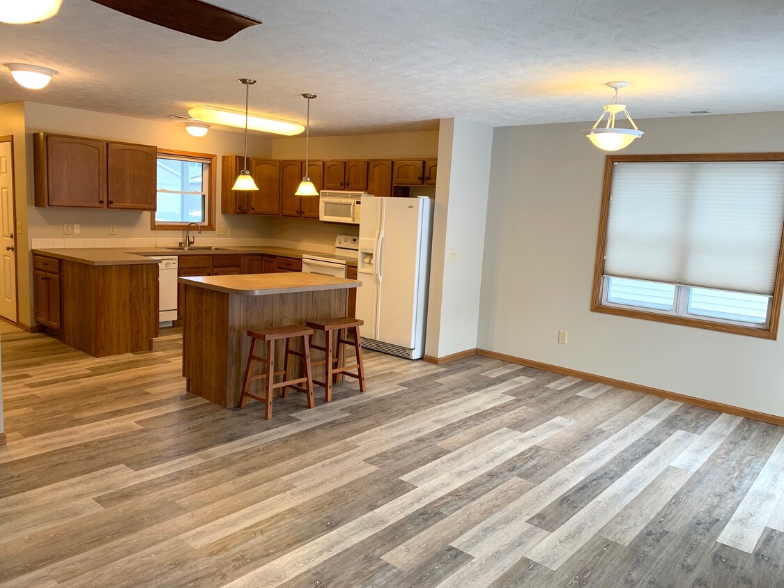 Large dining area with new vinyl plank flooring - 3611 McLaughlin Dr.