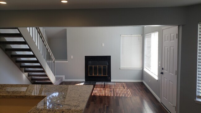 Living room from kitchen - 13813 E Lehigh Ave