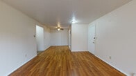 Located at 325 Nantucket Place in Vermilion, Ohio, this single-floor unit offers a practical and comfortable layout with a mix of wood-look and carpeted flooring throughout. The main living area is open and well-proportioned, featuring warm hardwood-style flooring, a ceiling fan, textured ceilings, and a sliding glass door that fills the space with natural light and provides direct access to an outdoor area with views of surrounding greenery.

The kitchen is appointed with dark cabinetry, granite-style countertops, a double-basin stainless steel sink, under-cabinet lighting, and includes a dishwasher and built-in microwave, offering a functional and updated cooking space.

The bedrooms are carpeted for comfort and include natural light from sliding or standard windows with outdoor views. At least one bedroom features a built-in closet with shelving, providing organized storage. Baseboard heating units are present throughout the carpeted rooms.

The bathroom is clean and straightforward, featuring a full tub-shower combination, a white vanity with storage, a toilet, and tile flooring. The overall ambiance of the unit is bright and neutral, with white walls throughout creating a move-in ready environment.