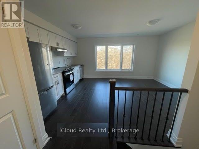 Photo du bâtiment - 33 Wild Rose Gardens