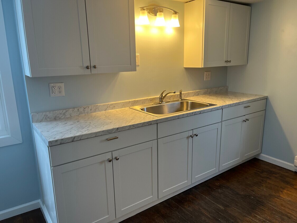 All new appliances and refinished hardwood floor throughout the apartment - 205 Wright Ave