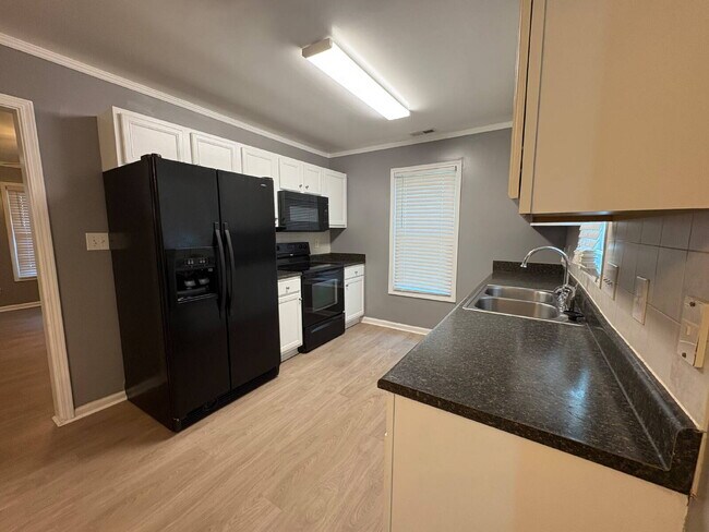 Building Photo - Spacious 4-Bedroom Sanctuary with Cozy Fireplace on Chimney Swift Drive!