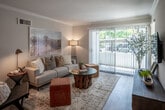 Located in the coastal community of San Clemente, California, this single-story residence at 519 Via Presa offers a thoughtfully designed interior that blends modern updates with a warm, inviting aesthetic. The living room is a comfortable centerpiece, featuring crown molding, light wood-style flooring, and large sliding glass doors fitted with vertical blinds that allow an abundance of natural light and provide access to the outdoors. The space is well-proportioned, offering a relaxed yet stylish atmosphere.

Adjacent to the living area, a dedicated dining nook provides an intimate setting for meals, accented by crown molding and recessed lighting. The galley-style kitchen is efficiently laid out and impressively updated, showcasing rich wood-tone cabinetry, crisp white countertops, a deep stainless steel sink with a contemporary faucet, and a full suite of stainless steel appliances including a refrigerator, range, and microwave.

The bedroom is a tranquil retreat, highlighted by a ceiling fan, light wood-style flooring, and a generously sized window that fills the room with soft, natural light. The bathroom features a clean, modern design with a wide vanity with white countertop, wood-tone cabinetry, and a full tub-shower combination. Light flooring ties the space together with a cohesive, airy feel throughout.